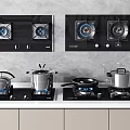 Modern Kitchen Countertop With Black Gas Stoves Cooktops And Pots Pans