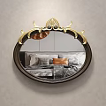 Elegant Oval Bedroom Mirror With Golden Decorative Frame Reflecting Bed And Pillows