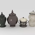 Assorted Decorative Jars Featuring Dark Green Brown And White Textured Designs