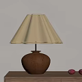 Brown Wooden Table Lamp With Beige Pleated Shade On Wooden Desk And Red Decor