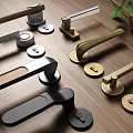 Various Design Metal Door Handles with Gold Silver Black Finishes on Wooden Background and Rose