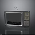 Vintage Electronic TV Set With Silver Case Antenna And Control Knobs