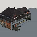 Old Red Brick Industrial Building With Black Roof And Multiple Windows
