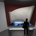 Silhouette Person Standing Near Scroll Structure In Modern Exhibition Space With Ambient Lighting