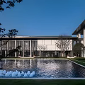 Modern Sales Office With Reflective Pool Fountain Glass Facade And Lush Landscaping 3d model