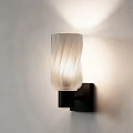 Wall Lamp With White Ribbed Glass Shade And Black Base On Light Wall