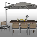 Outdoor Table And Chair Set With Beige Umbrella Wicker Chairs Decorative Vase And Fruit Bowl