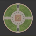 Monument Structure With Golden Statue On Circular Base And Green Lawn Cross Pathways