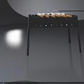 Grill With Skewers And Ice Cubes On Black Metal Frame With Wooden Handles