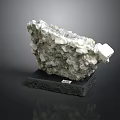 Natural Raw Stone Specimen With Crystal Structure On Black Base
