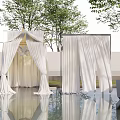 Elegant Pergola With White Curtains And Water Reflections Surrounded By Trees
