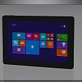 Portable Tablet With Black Frame Displaying Start Interface And Colorful App Icons On Blue Screen