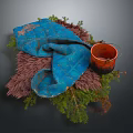 Blue Textured Cloth With Brown Container And Green Plants On Furry Base