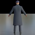 Man Wearing Long Gray Coat Waistcoat Tie and Cap Standing on Simple Background