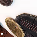 Wooden Console Cabinet In Entryway With Circular Wooden Wall Decor Geometric Ornaments And Books