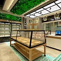 Sweet Dessert Shop Interior With Green Plant Ceiling Glass Display Cases And Counter