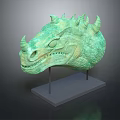 Detailed Green Dragon Head Sculpture With Textured Surface On Gray Stand