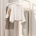 Indoor Clothing Rack Featuring Hanging Sweaters Coats Folded Clothes And Storage Boxes