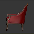 Classic Red Chair With Ornate Carved Wooden Arms And Tufted Upholstery