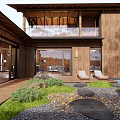 Japanese Courtyard Garden With Wooden House Stone Path Fire Pit And Loungers
