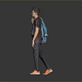 Man Wearing Gray T-shirt Blue Graphic Dark Pants Orange Shoes With Backpack Against Gray Background