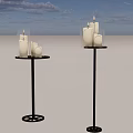 Decorative Candle Holders With White Candles On Black Metal Stands