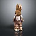 Brown Rabbit Figurine With Long Ears Wearing White Shirt And Overalls Standing On Dark Background