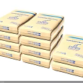 Stone Wood Construction Supercrete Packaged In Stacked Brown Paper Bags With Blue Labels