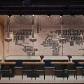 Cozy Restaurant Interior With Neon Sign Brick Wall Fruit Display And Metallic Ceiling