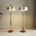 Two Modern Floor Lamps with Wooden Poles Decorative Balls and Light Lampshades in Minimalist Interior