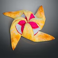 Golden Windmill Shaped Pastry With Crispy Crust And Pink White Filling