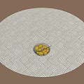 Round Rug with Geometric Pattern on Wooden Floor Featuring Bowl of Stones in Center
