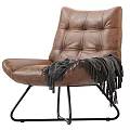 Brown Leather Tufted Leisure Chair With Gray Fringed Blanket Black Metal Legs Modern Design