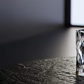 Transparent Glass Cup With Irregular Patterns On Dark Textured Table Near Window Light 3d model