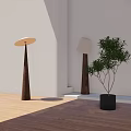 Modern Floor Lamps With White Shades Dark Bases Green Plant Against Light Wall Wooden Floor