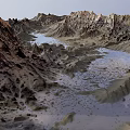 Rugged Mountainous Landscape With Winding River And Rocky Peaks Across Vast Terrain