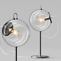 Modern Transparent Glass Globe Floor Lamp With Metal Stand And Warm Lit Bulb