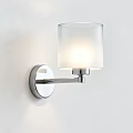 Modern Wall Sconce With Metal Bracket And Glass Shade Mounted On White Wall Illuminated