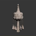 Two Traditional Sculptural Carvings With Ornate Tops Intricate Patterns And Hanging Tassels