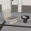 Elegant White Modern Leisure Chair on Light Carpet with Black Side Table and Books