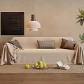 Neutral Toned Three Seater Sofa With Blanket Pillows Potted Plant And Pendant Lamp By Framed Artwork