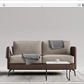 Beige Fabric Two Seater Sofa With Gray Blanket And Small Coffee Table