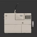 Cube Shaped Compact Computer Device With Small Display Screen Blue Indicator Lights And Antenna