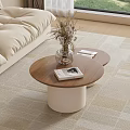 Beige Sofa With Two Round Coffee Tables Wooden Tabletop White Cylindrical Base And Magazines