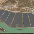 Aerial View Of Large Scale Solar Power Farm Along The Green Riverside Rural Mountainous Landscape