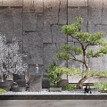 Gray Stone Garden Wall Design With Pine Tree White Flowering Plants And Gravel Decor