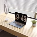 Modern Desk Setup With Laptop Lamp Small Plant And Sunlight Shadows From Blinds