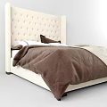 Cozy Double Bed With Tufted Beige Headboard Brown Comforter And Pillows