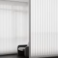 White Vertical Blinds Covering Window In Modern Living Room With Soft Light And Gray Chair