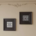 Abstract Art in Black Frames with Geometric and Maze Patterns on Beige Wall and Golden Carvings